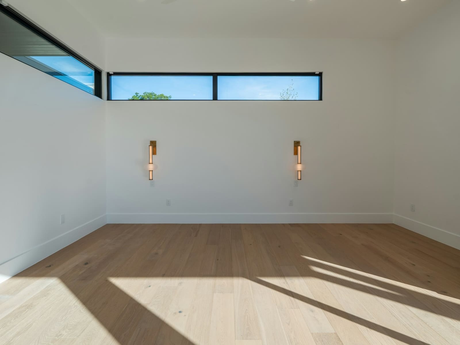 Empty, clean room with hardwood floors after a cleanout